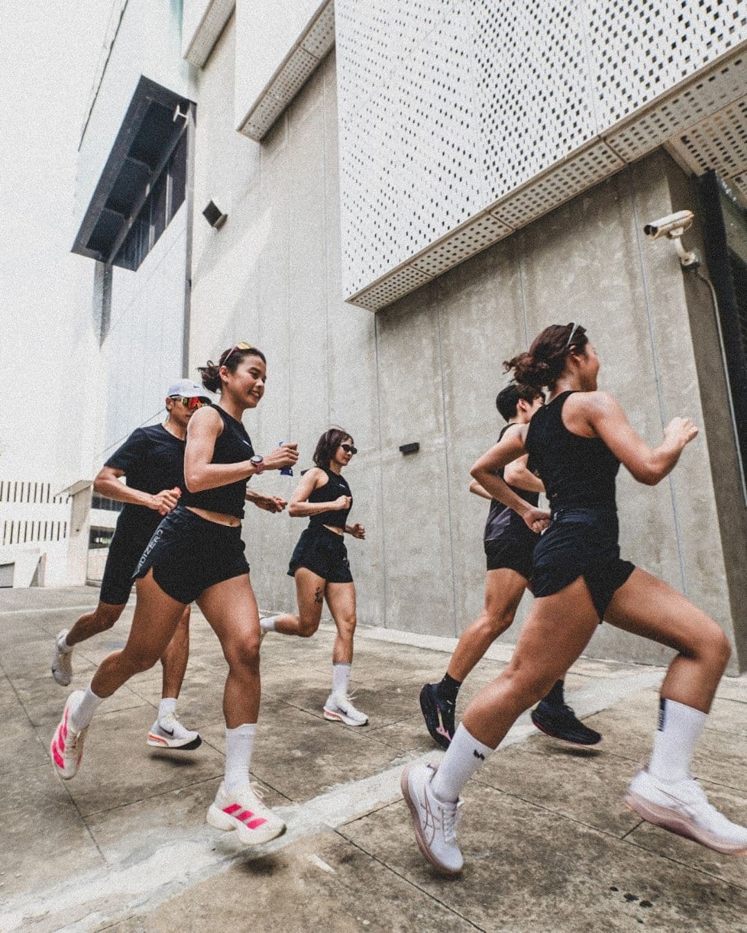 Group of runners sprinting together